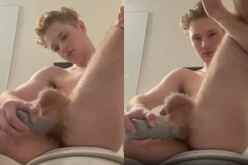 Twink fucks himself with a toy in the bathroom