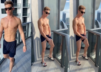 Young fit guy jerks off on the balcony – U11875612