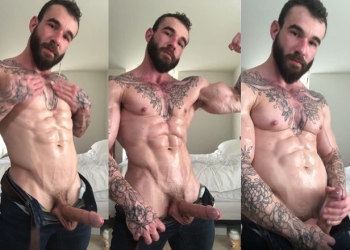 Sweaty muscular guy with tattoos jerks off