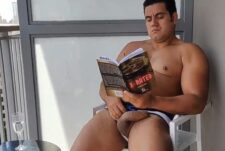 Yuri Gaucho jerks off on the balcony while reading a book
