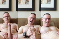 Mature guy jerks his cock on the sofa