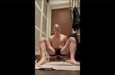 Bastian Gate rides a fat dildo on the floor while caged