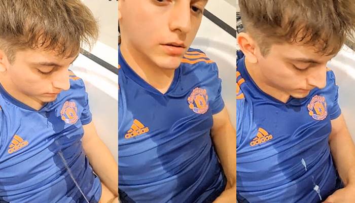 Young guy pisses on himself before he cums