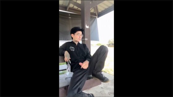 Asian twink jerks off at a bus stop