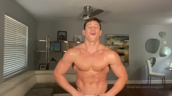 Reno Gold gives strip show in his white tracks on couch